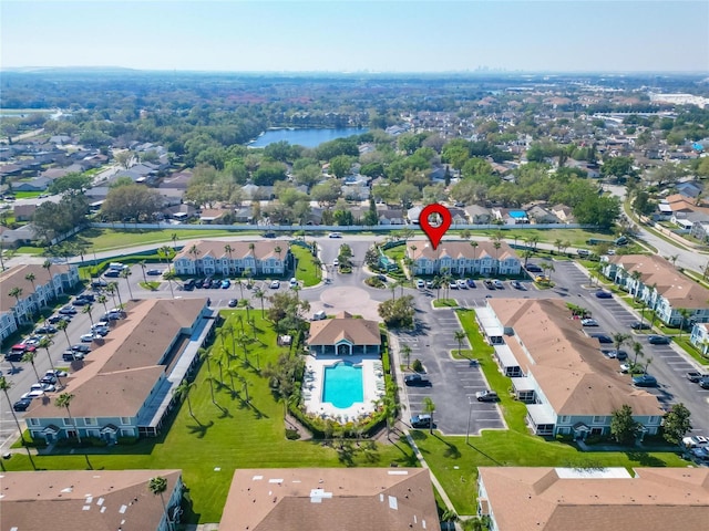 birds eye view of property featuring a residential view and a water view