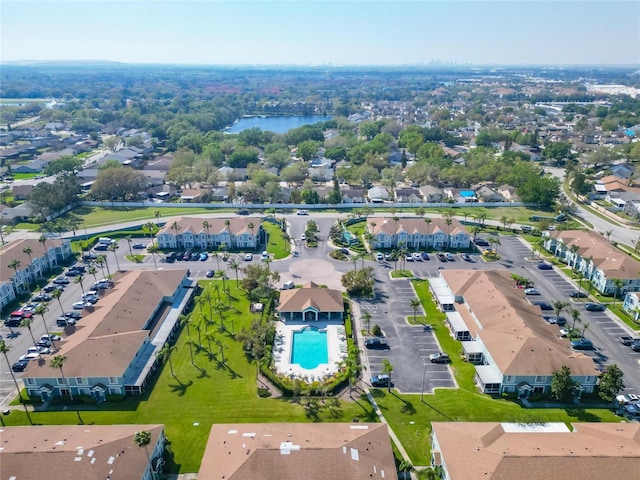 birds eye view of property featuring a residential view and a water view