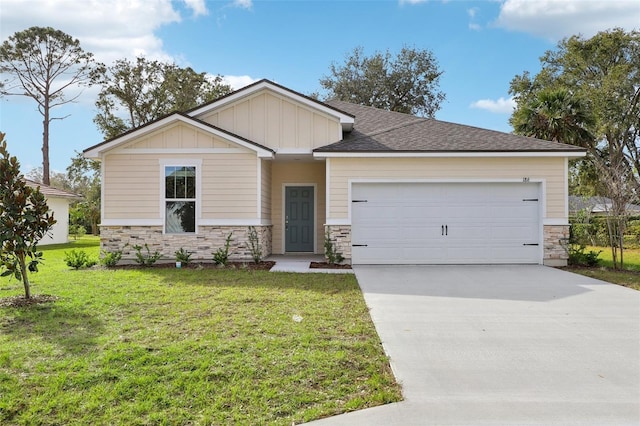 craftsman inspired home with a front yard, concrete driveway, a garage, stone siding, and board and batten siding