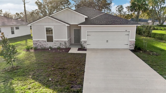 view of front of house featuring a front yard, driveway, an attached garage, stone siding, and board and batten siding