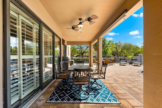 view of patio / terrace featuring a ceiling fan and fence