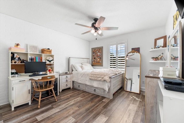 bedroom with a ceiling fan and wood finished floors