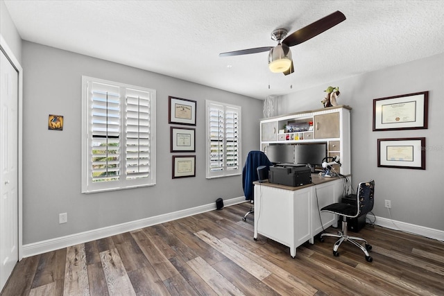 office area with baseboards, a textured ceiling, and dark wood finished floors