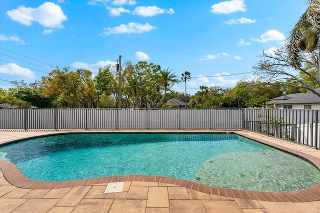 view of swimming pool with a fenced in pool and fence