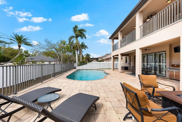 view of pool with a fenced in pool, a patio, and fence