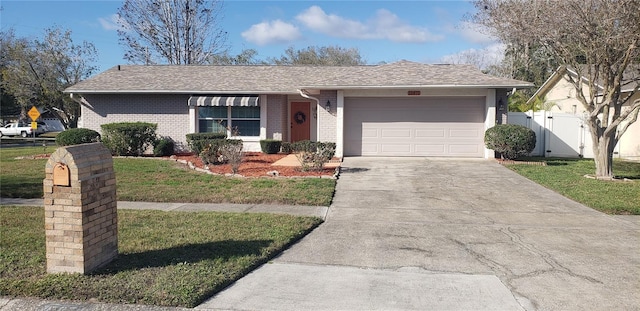 ranch-style home with a front lawn, a gate, fence, concrete driveway, and a garage