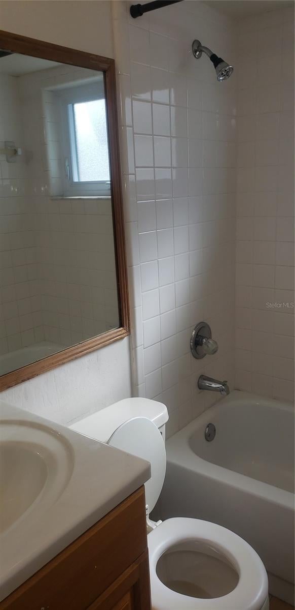 full bathroom with vanity, toilet, and tub / shower combination