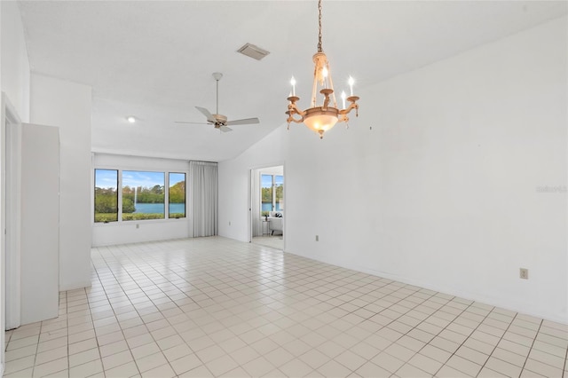 empty room with light tile patterned floors, ceiling fan with notable chandelier, visible vents, and high vaulted ceiling