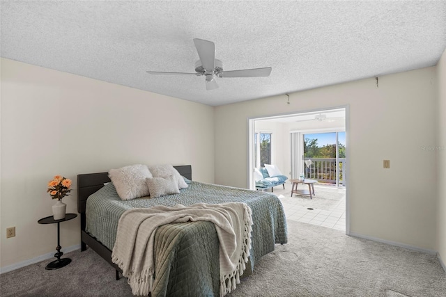 bedroom with access to exterior, carpet, baseboards, and a textured ceiling