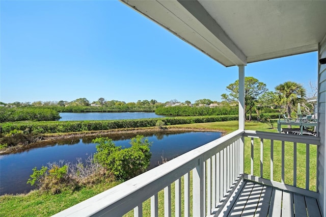 balcony featuring a water view