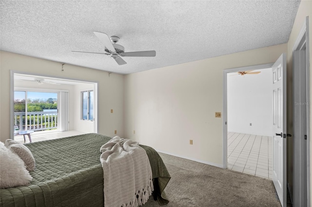 carpeted bedroom with baseboards, a textured ceiling, and ceiling fan