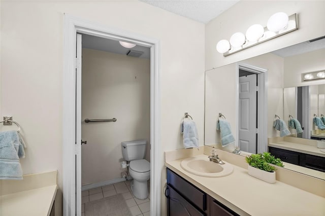 bathroom with tile patterned floors, visible vents, toilet, a textured ceiling, and vanity