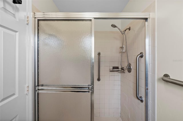 bathroom featuring a shower stall