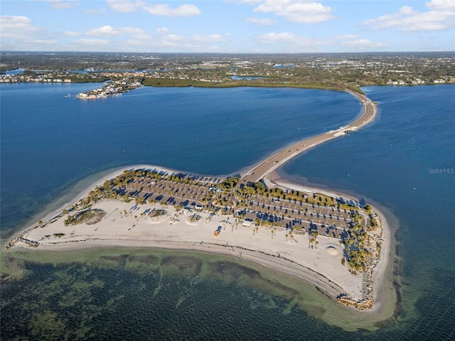 aerial view featuring a view of the beach and a water view