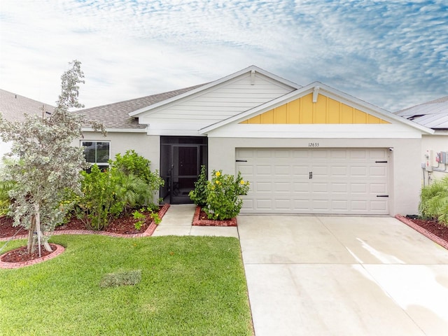 ranch-style house with driveway, a front yard, an attached garage, and a shingled roof