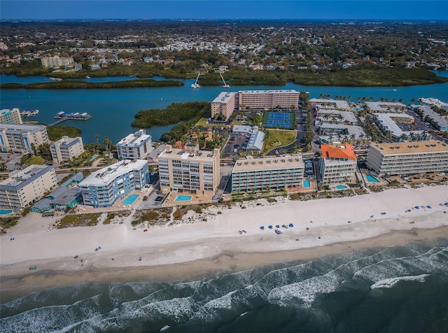 aerial view featuring a city view, a view of the beach, and a water view