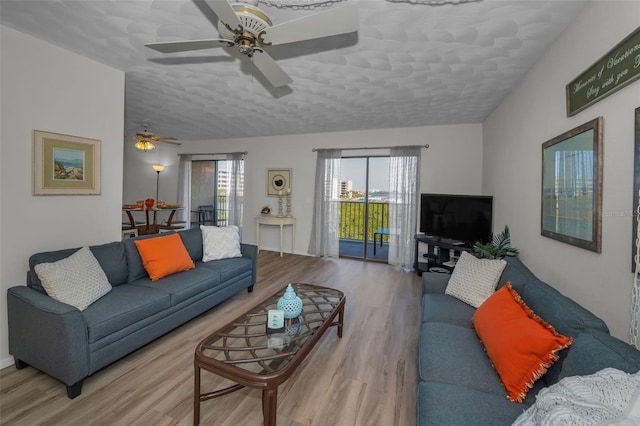 living room featuring wood finished floors and ceiling fan