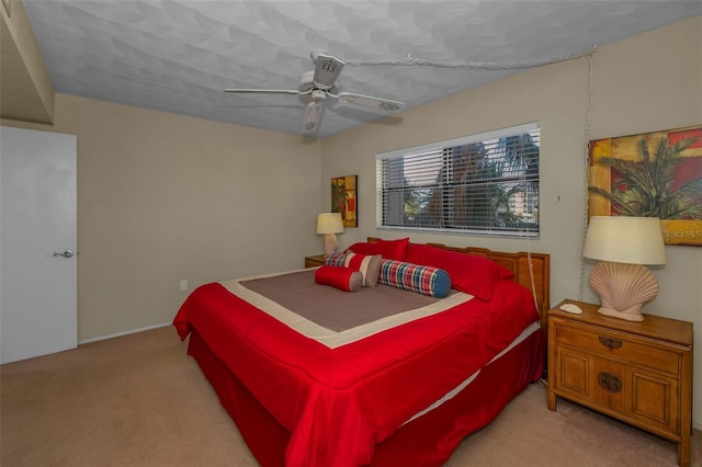 bedroom with carpet floors and a ceiling fan