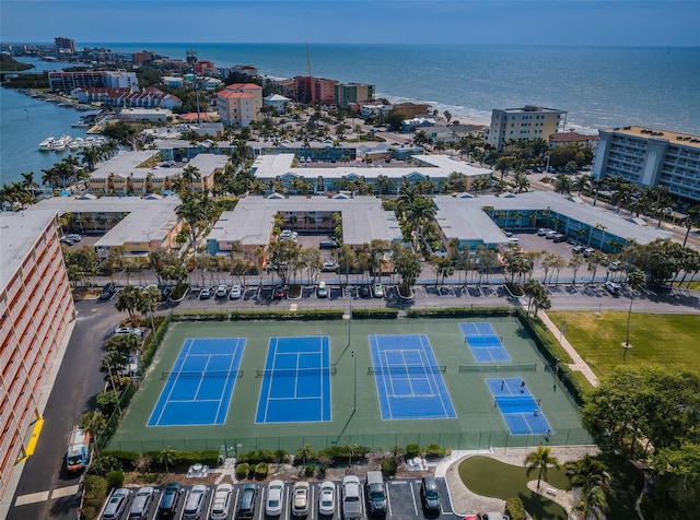 drone / aerial view featuring a city view and a water view