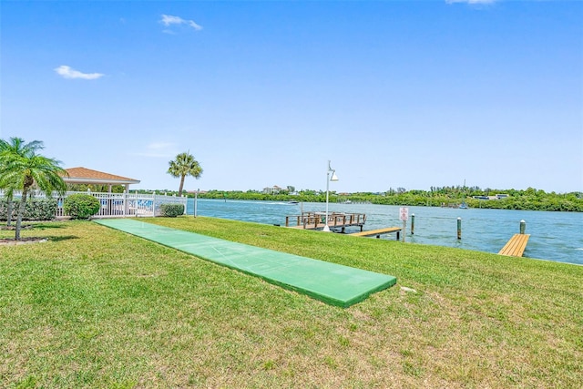 exterior space with a yard and a water view