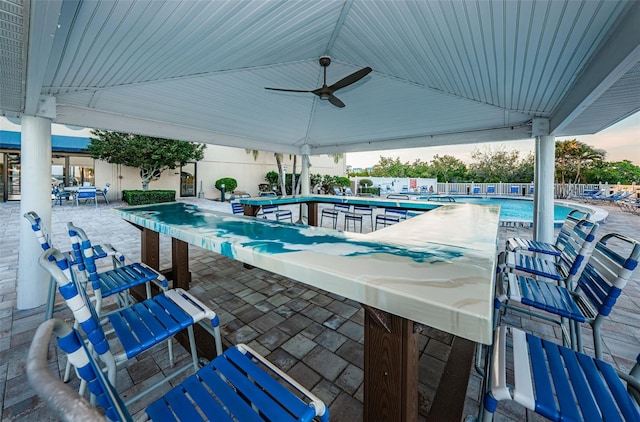 pool featuring a gazebo, a patio, a ceiling fan, and fence