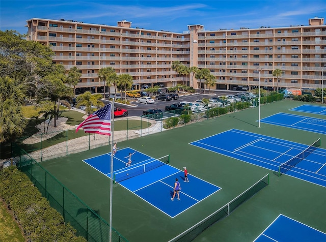 view of tennis court with fence