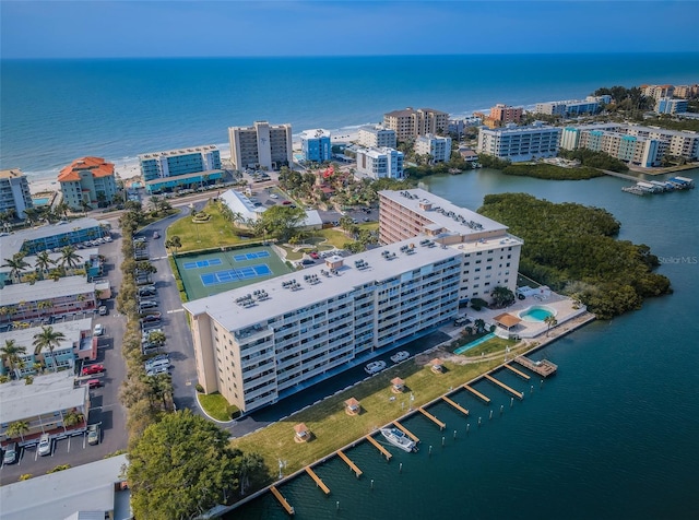 drone / aerial view featuring a water view and a view of city