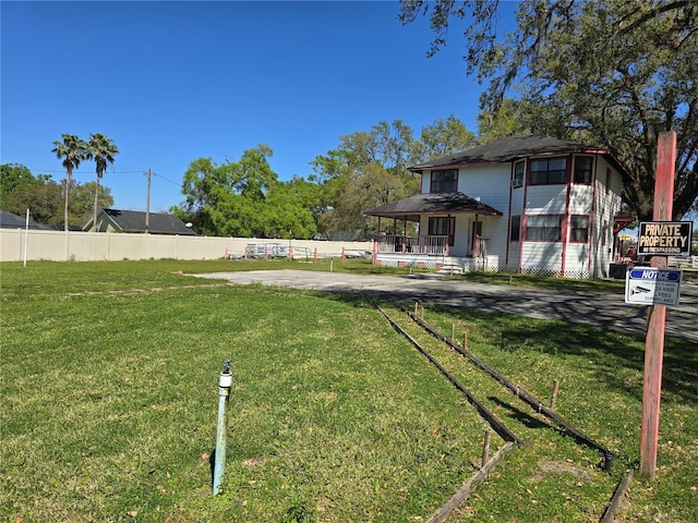 view of yard featuring fence