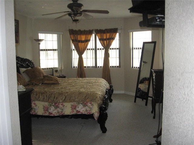 bedroom with carpet flooring, a ceiling fan, and baseboards