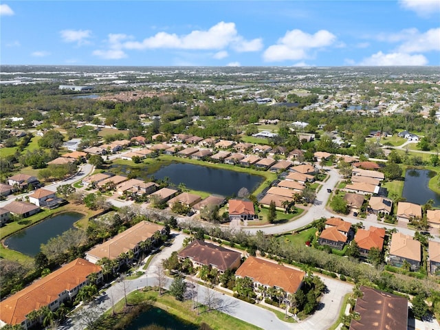 birds eye view of property featuring a residential view and a water view