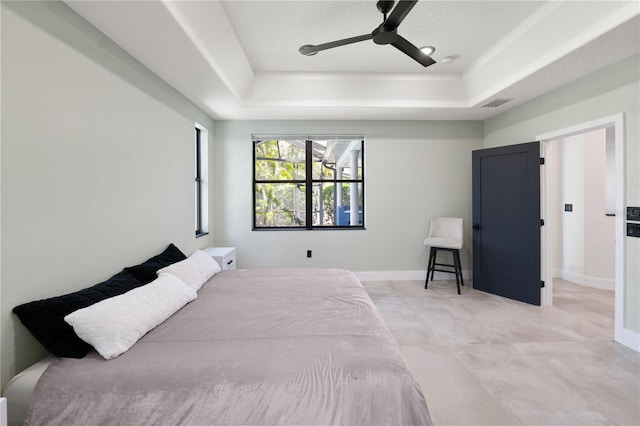 3635 80th Dr E, Sarasota, FL 34243 - bedroom featuring a ceiling fan, a raised ceiling, baseboards, and visible vents