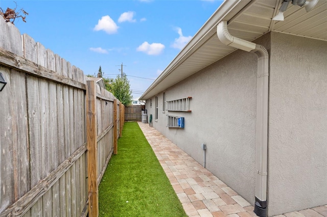 view of yard featuring a patio area and a fenced backyard