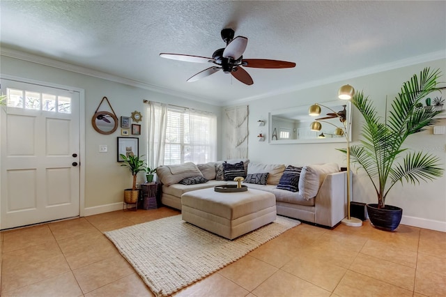 living area featuring crown molding, light tile patterned flooring, baseboards, and a textured ceiling