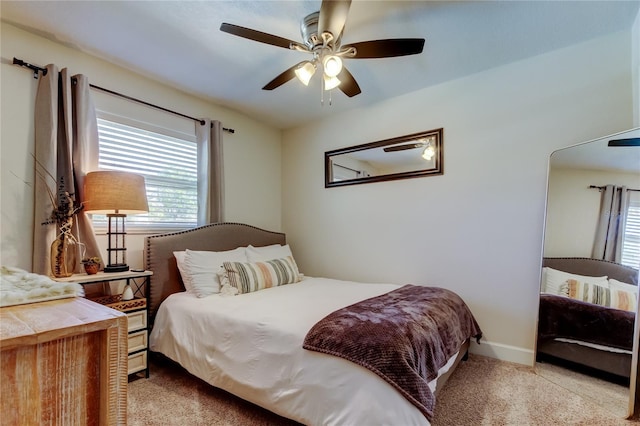 bedroom with baseboards, carpet floors, and ceiling fan