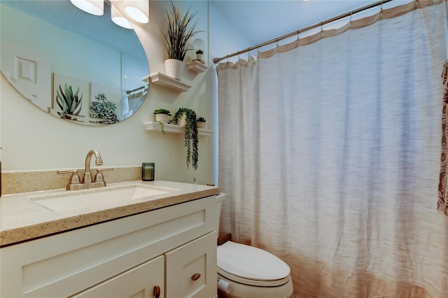 full bathroom featuring toilet and vanity