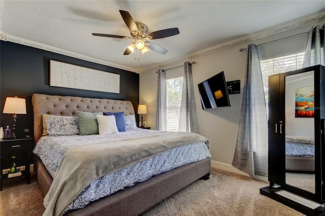 carpeted bedroom with a ceiling fan and baseboards