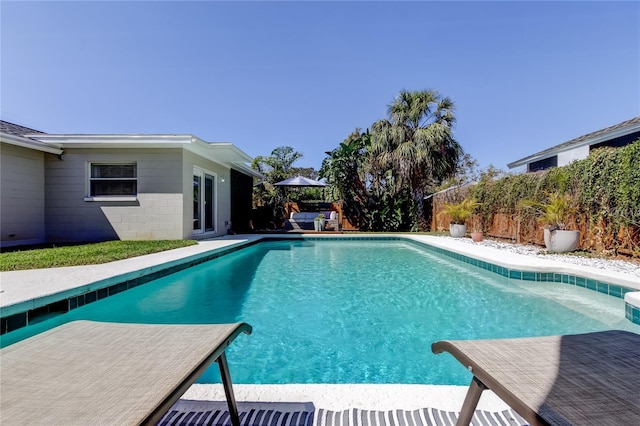 view of pool with a fenced in pool, a patio, a water slide, and a fenced backyard