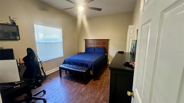 bedroom with dark wood-type flooring, baseboards, and ceiling fan