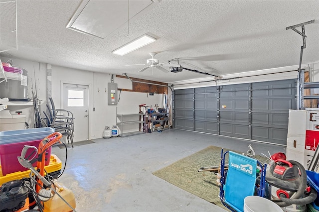 garage with electric panel and a garage door opener