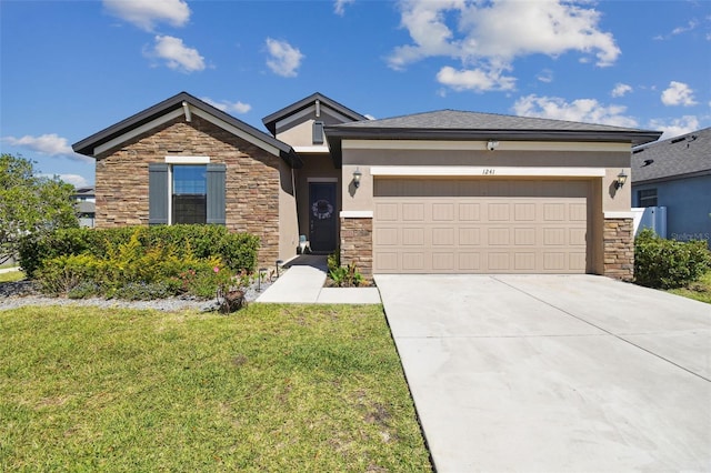 view of front of house featuring stucco siding, driveway, stone siding, a front yard, and a garage