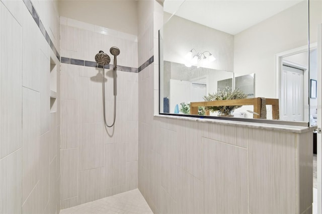 bathroom featuring a tile shower