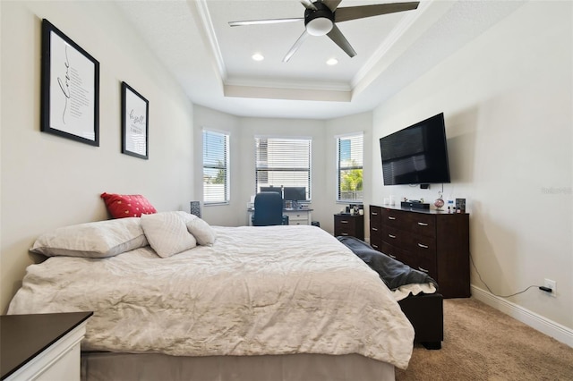 carpeted bedroom with baseboards, recessed lighting, ceiling fan, crown molding, and a raised ceiling