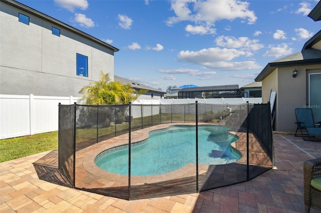 view of pool featuring a patio area, a fenced in pool, and a fenced backyard