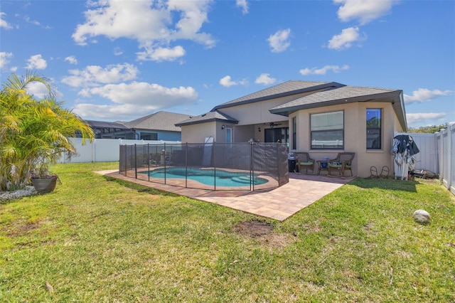 view of pool featuring a patio, a lawn, a fenced in pool, and a fenced backyard