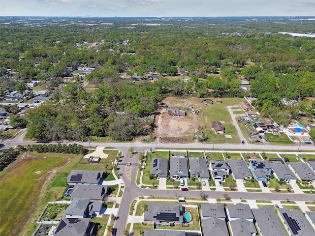 bird's eye view with a forest view and a residential view