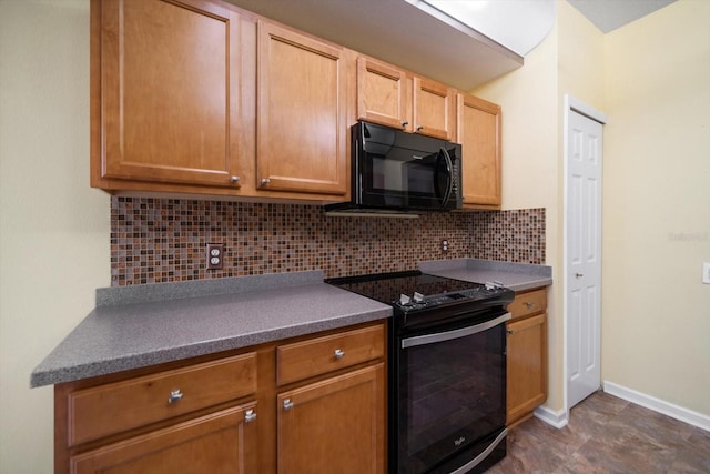 kitchen with decorative backsplash, baseboards, dark countertops, and black appliances