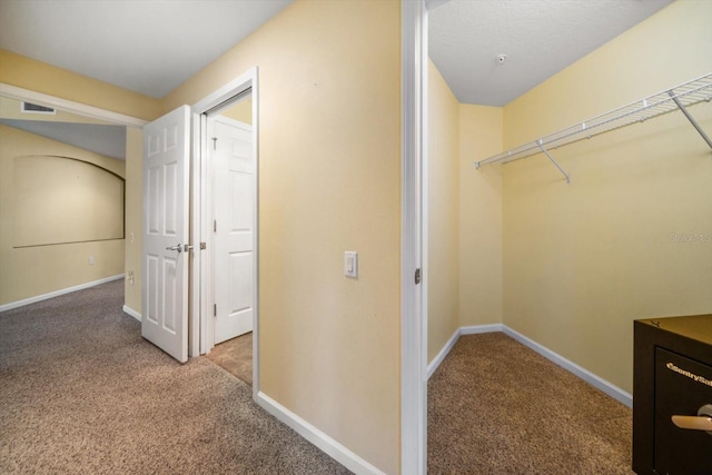 interior space with visible vents and carpet flooring