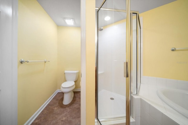 bathroom with toilet, a bath, baseboards, and a stall shower