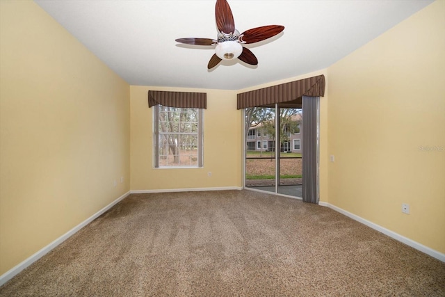 unfurnished room with baseboards, carpet floors, and ceiling fan