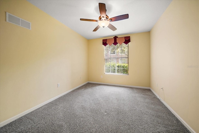 spare room with visible vents, baseboards, carpet floors, and a ceiling fan